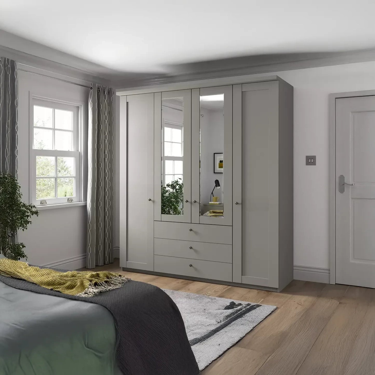 Wiemann Marlo Pebble Grey 4 Door Wardrobe with 3 Drawers, Mirror and cornice - styled in room