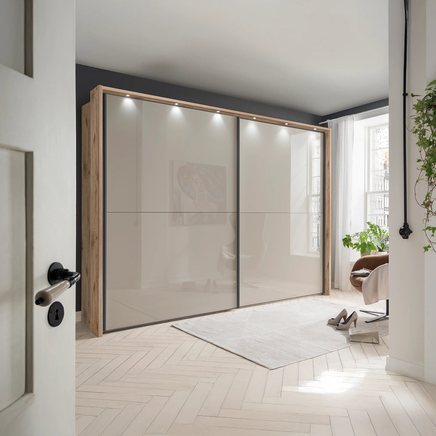 Wiemann Bristol Berlin Rustic Oak Carcase and Pebble Grey Glass Sliding Door Wardrobe with Lights in 160cm, 210cm, 260cm and 310cm widths.