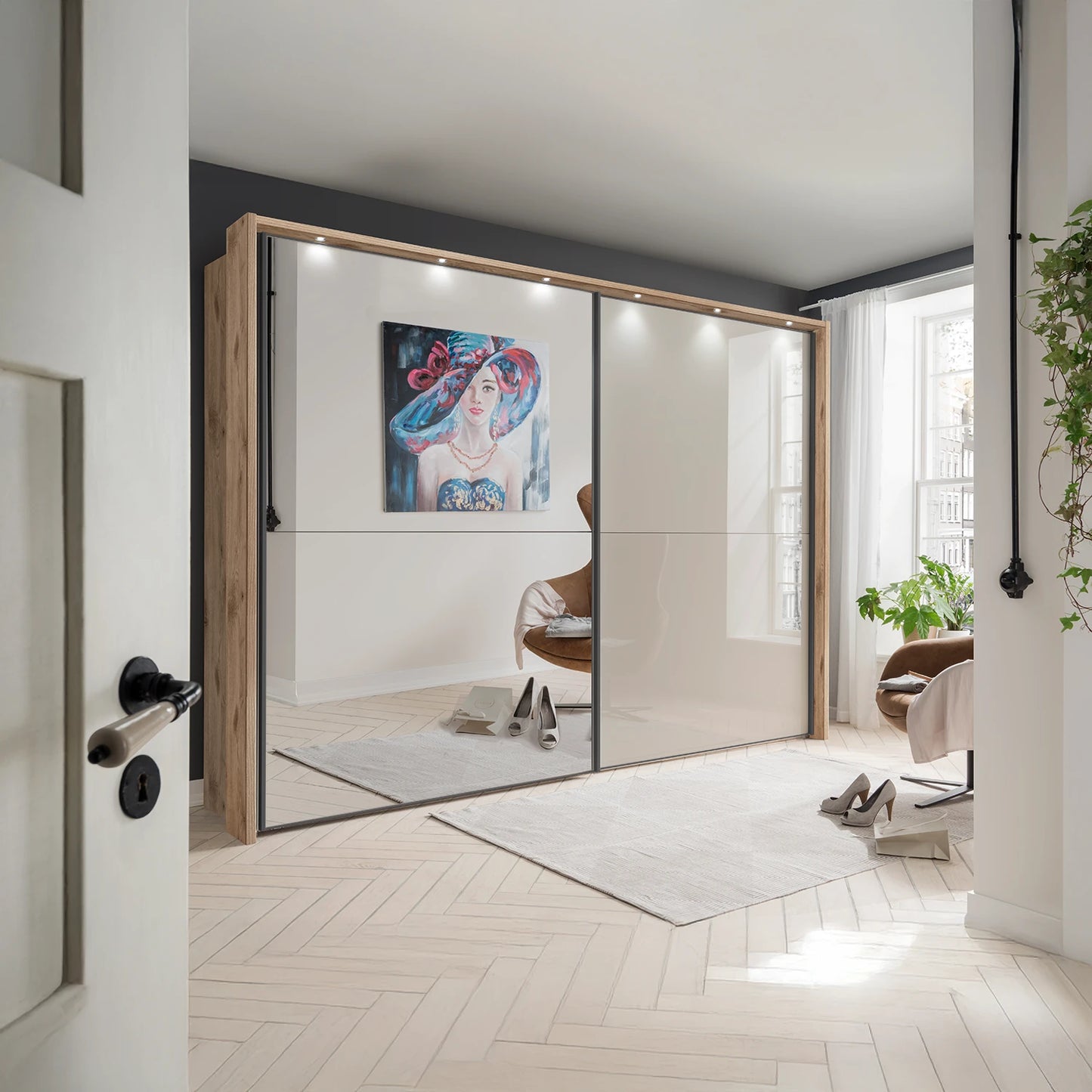 Wiemann Bristol Berlin Rustic Oak Carcase and Pebble Grey Glass Sliding Door Wardrobe with Mirror and Lights in 160cm, 210cm, 260cm and 310cm widths.