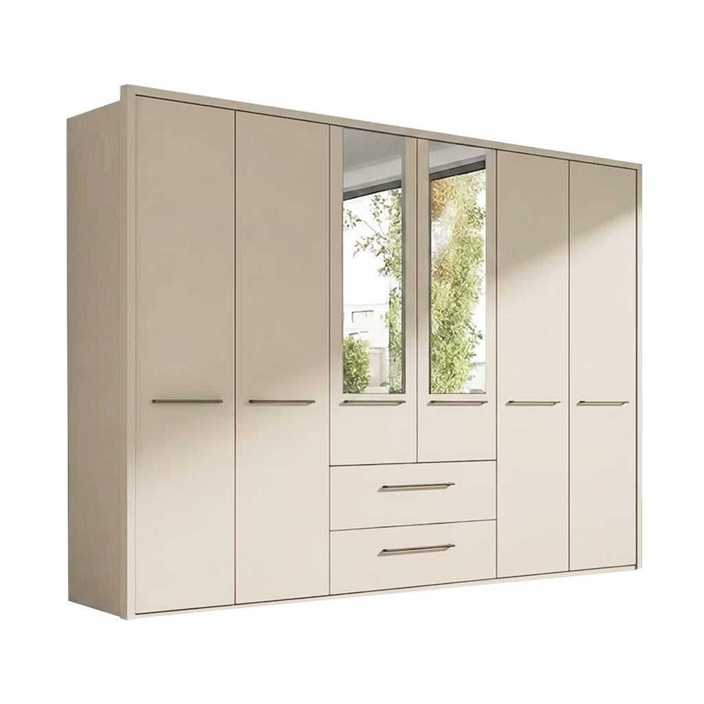 A modern Wiemann Kairns six-door wardrobe with two central doors featuring mirror inserts and two drawers below, finished in a light beige wood grain with slim silver handles.