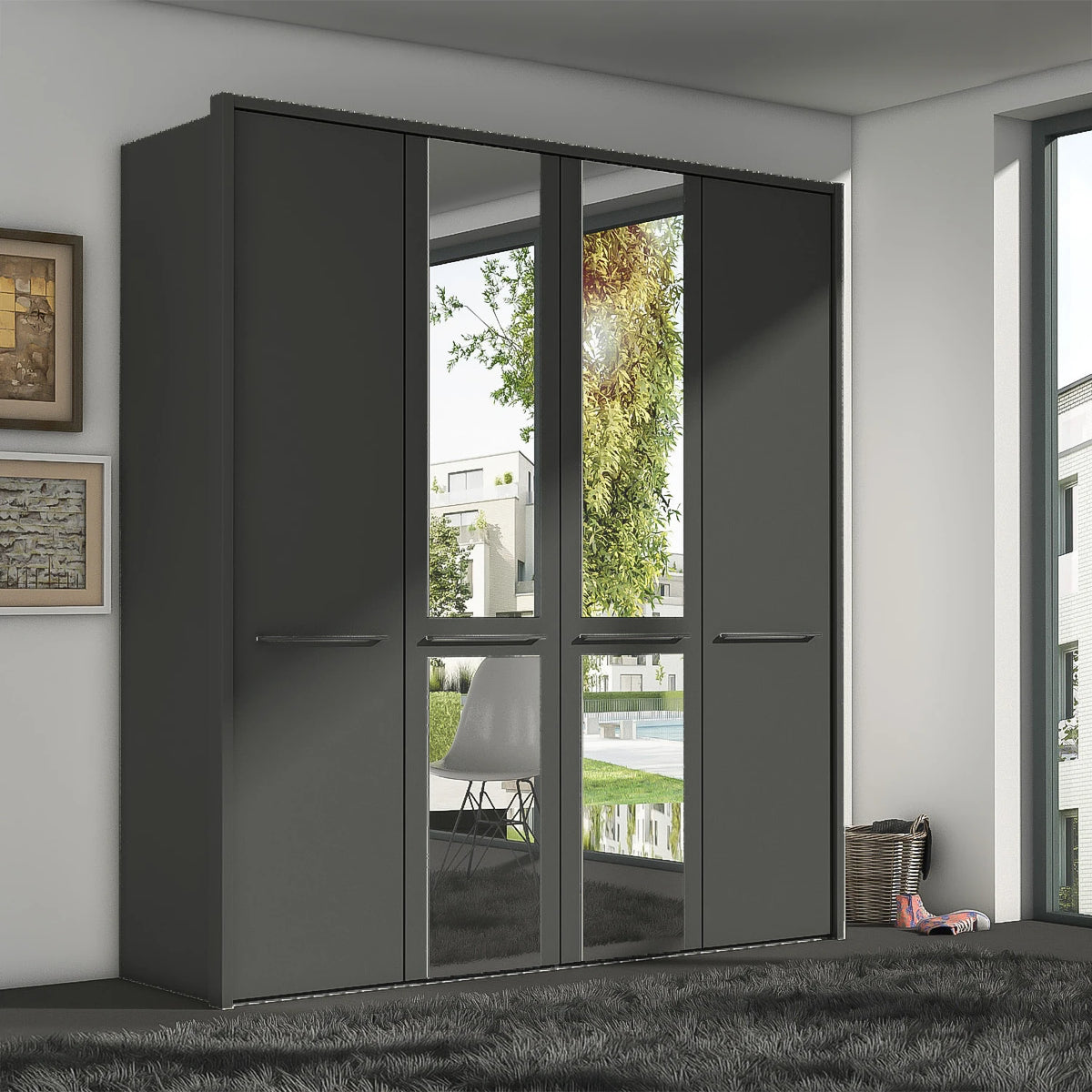 A modern four-door Wieman Cairns wardrobe with two solid dark gray doors and two mirrored glass doors, set in a contemporary room with a gray rug and light gray walls.