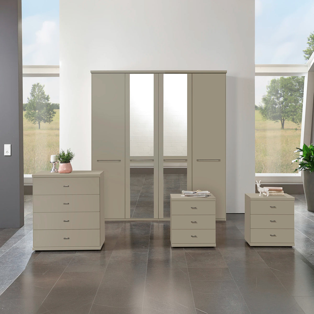 A modern Wiemann Cairns 4 Piece bedroom furniture set consisting of a four-door wardrobe with Mirror, a four-drawer chest, a pair of three-drawer bedside table in Pebble Grey colour