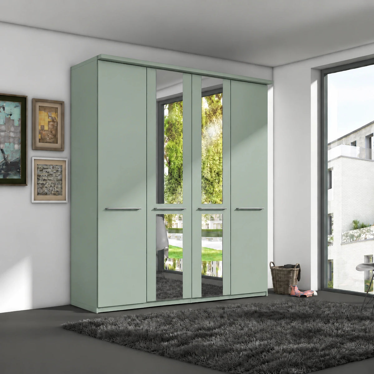 A tall four-door Wiemann Cairns wardrobe in a pale sage green finish, featuring two doors with mirrored glass panels and two solid doors with horizontal handles, shown in a modern room setting.