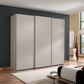 A modern Low height  three-door Wiemann Darwin wardrobe with matte Pebble Grey doors, Aluminium Door handle Bars