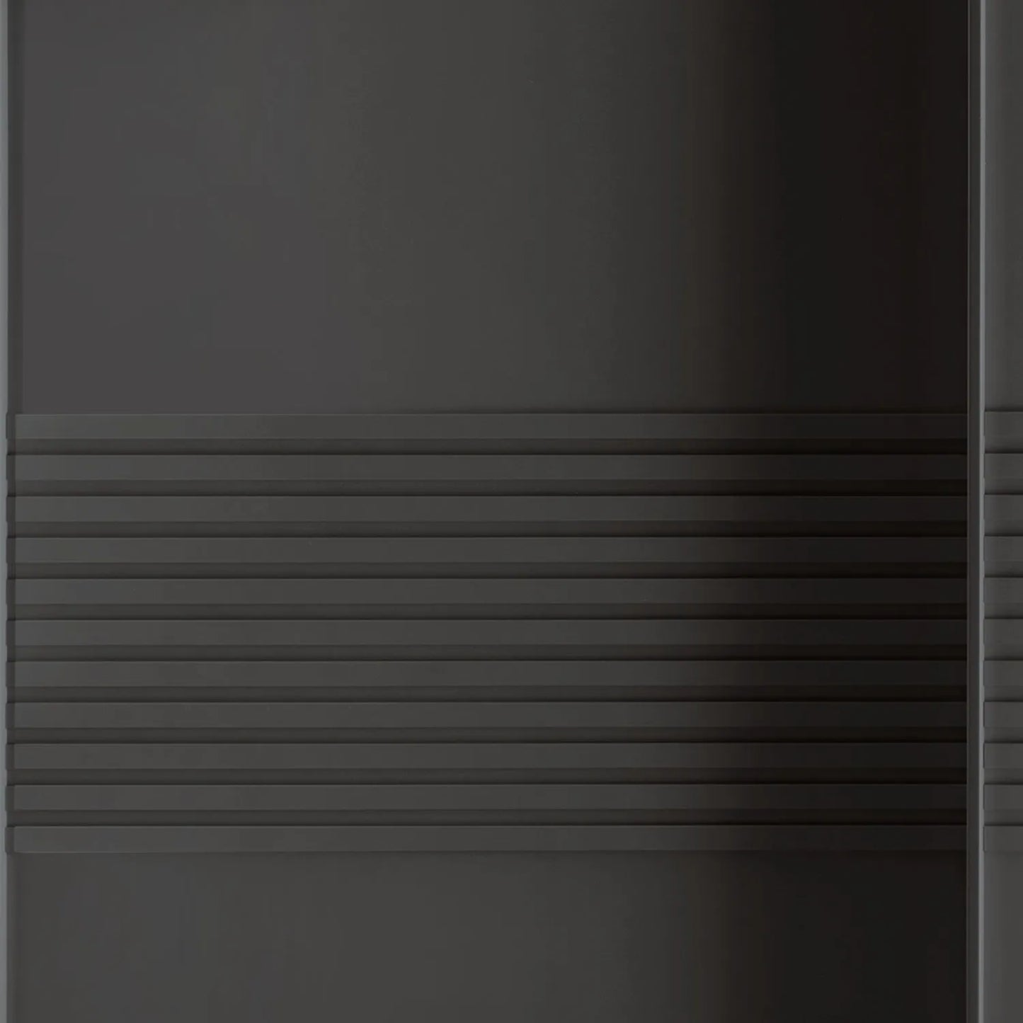 Close-up of a Wiemann Genova Kontrast Large 3-Door Sliding Wardrobe in Graphite Colour with Horizontal Trims on the Doors