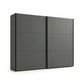 Modern black wardrobe with sliding doors on a white background