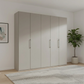 Large Wiemann Halver  wardrobe with five doors in a room with a plant and framed picture.