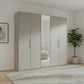 Large pebble grey wardrobe with five doors in a room with a plant and framed picture.