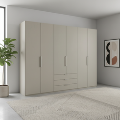 Large 6 Door Pebble Grey Wiemann wardrobe with drawers in a modern room with a plant and abstract art.