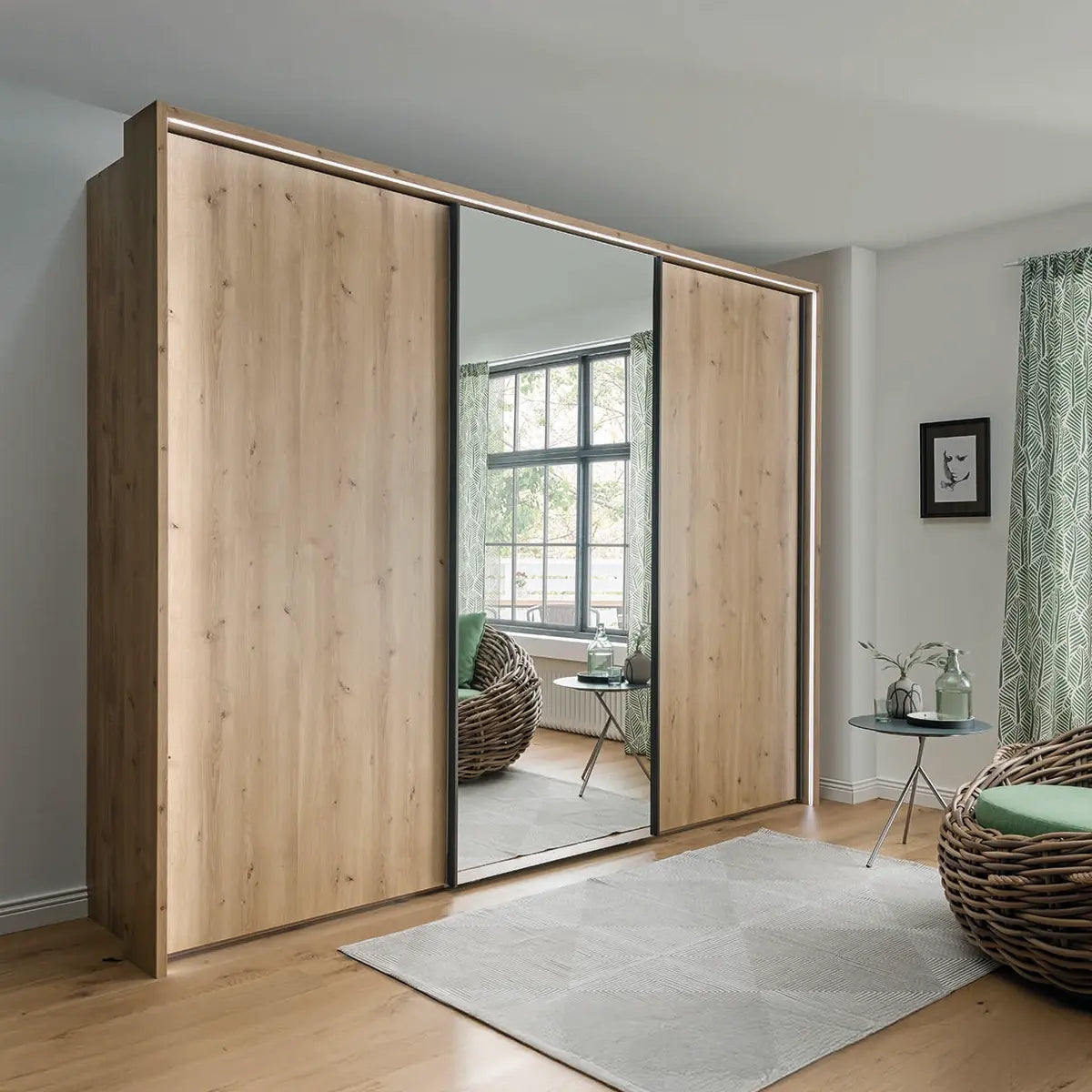 Large Oak Sliding Wardrobe with Mirrored Centre Doors with Light Passepartout Frame 