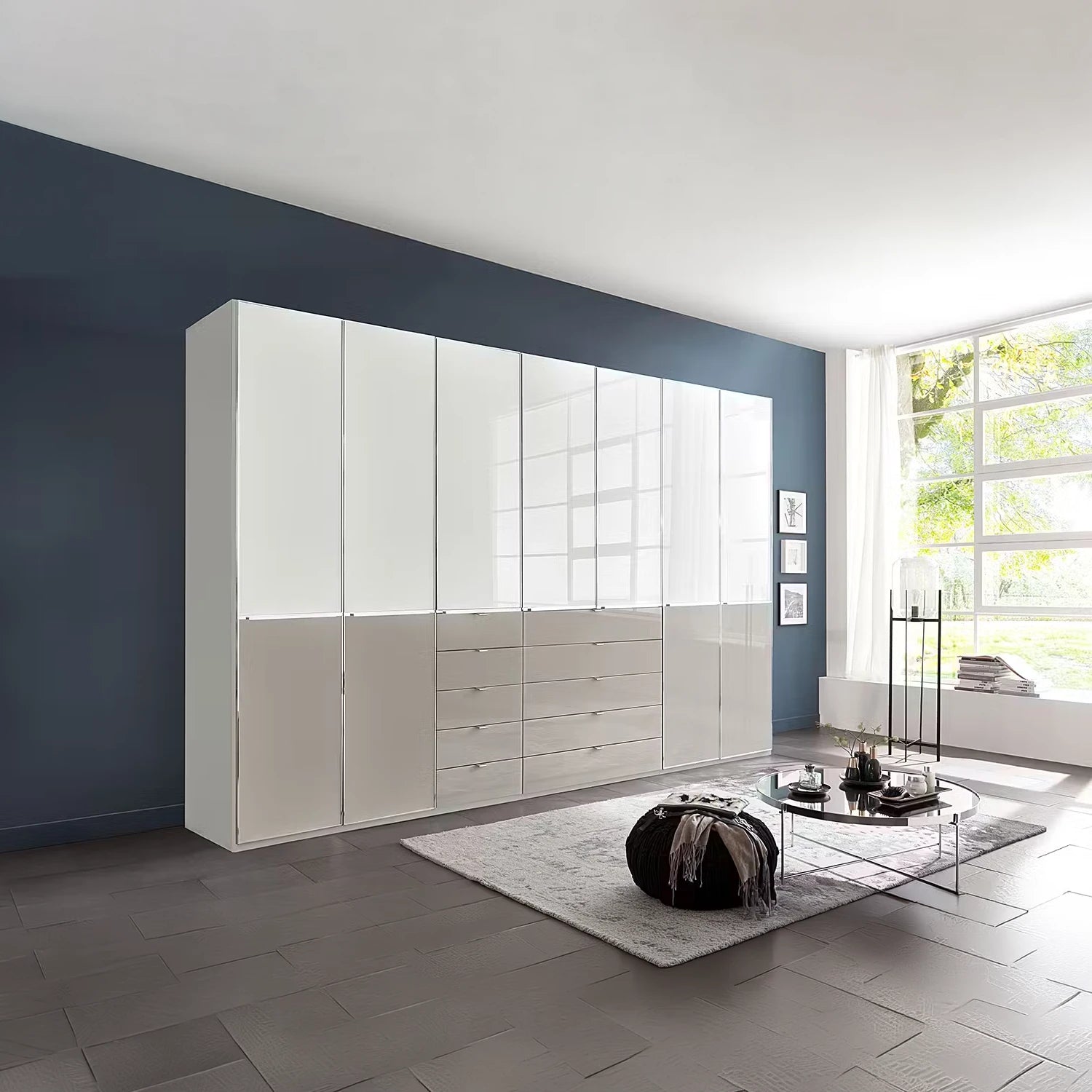 A large modern 236cm High wardrobe with Storage Drawers in glossy white glass and Pebble grey glass, shown installed in a contemporary living room 