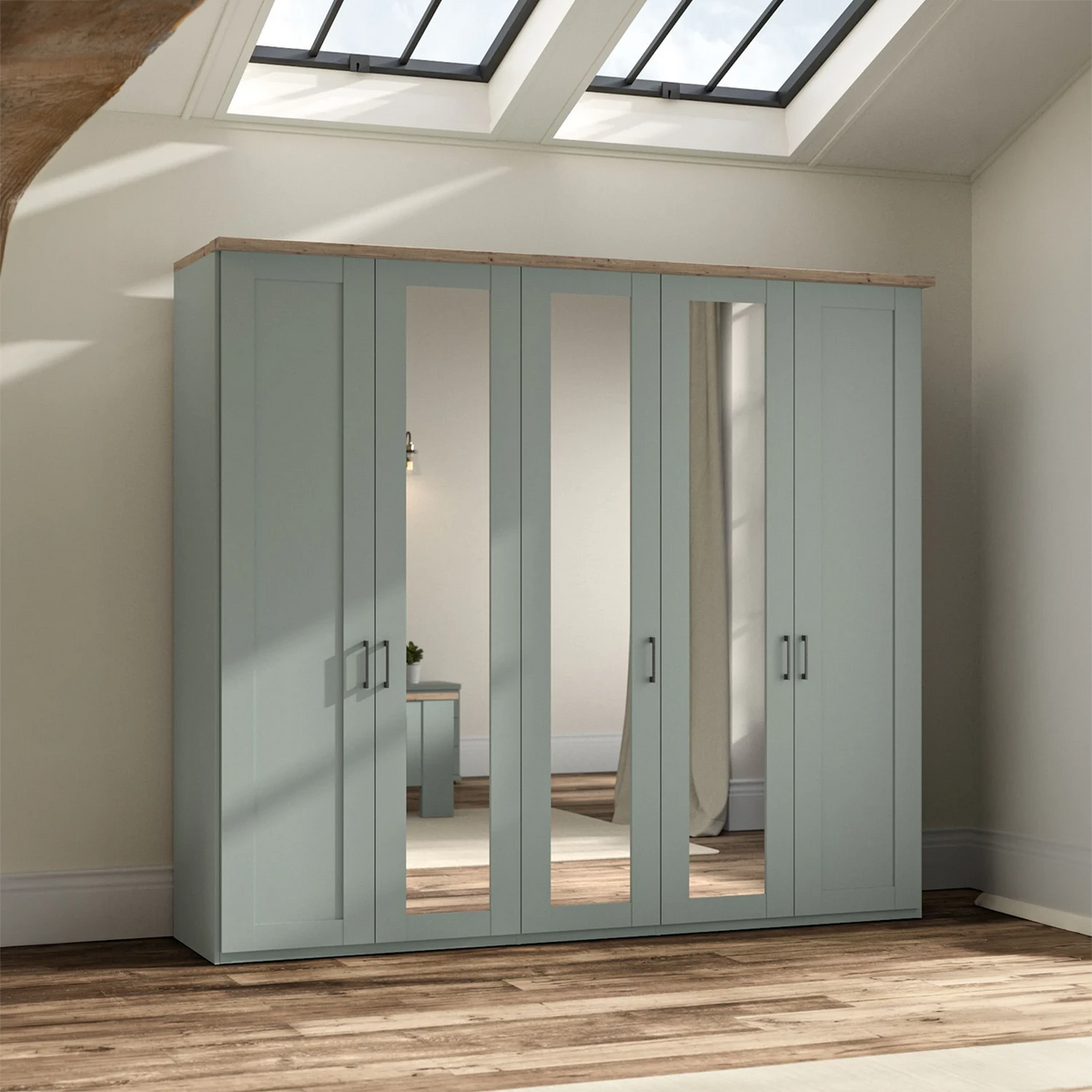 Wiemann Truro five-door wardrobe in a muted sage green color with three mirrored doors 