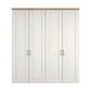 A four-door Wiemann Truro Shaker style wardrobe with paneled doors in a White, featuring a natural wood top cornice.