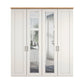 A tall white Wiemann Truro four-door wardrobe with two Mirror doors and two solid doors, and Oak Cornice