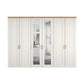 Wiemann Truro Large 6 Door Hinged Wardrobe in White colour with Middle Mirror Door and Oak Cornice Width 300cm Height 220cm