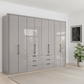 Wiemann Saka 300cm Bi-Fold Wardrobe With 8 Glass Doors & 6 Glass Drawers with Pebble Grey Carcase