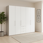 Wiemann Loft 5 Doors & 3 Drawers With Bi-Fold Doors Wardrobe in White with Pebble Grey Carcase styled in a Bedroom