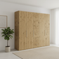 Wiemann Loft 5 Doors & 3 Drawers With Bi-Fold Doors Wardrobe in Bianco Oak styled in a modern room