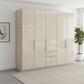 Wiemann Loft 5 Doors & 3 Drawers With Bi-Fold Doors Wardrobe in Glass Champagne styled in a modern room