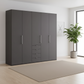 Wiemann Loft 5 Doors & 4 Drawers With Bi-Fold Doors Wardrobe in Havana styled in a modern room