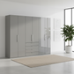 Wiemann Loft 6 Doors & 4 Drawers With Bi-Fold Doors Wardrobe in Glass Pebble Grey styled in a modern room