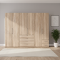 Wiemann Loft 6 Doors & 4 Drawers With Bi-Fold Doors Wardrobe in Rustic Oak styled in a modern room front view