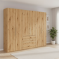 Wiemann Loft 6 Doors & 4 Drawers With Bi-Fold Doors Wardrobe in Bianco Oak styled in a modern room