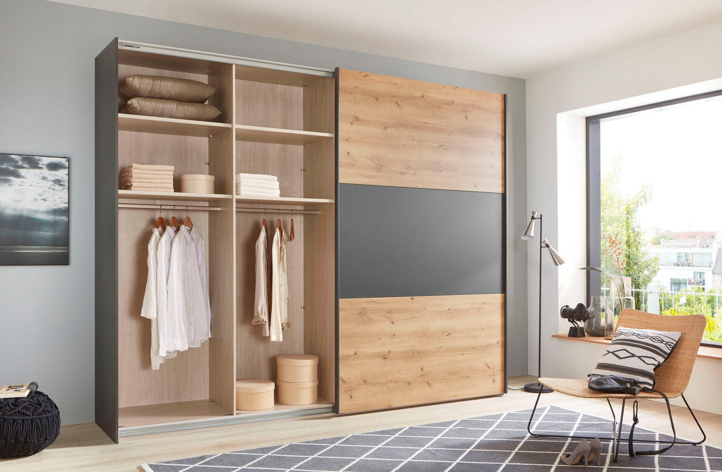 Corfu Bianco Oak & Graphite Sliding Door Wardrobe - Interior View Styled in a Living Room
