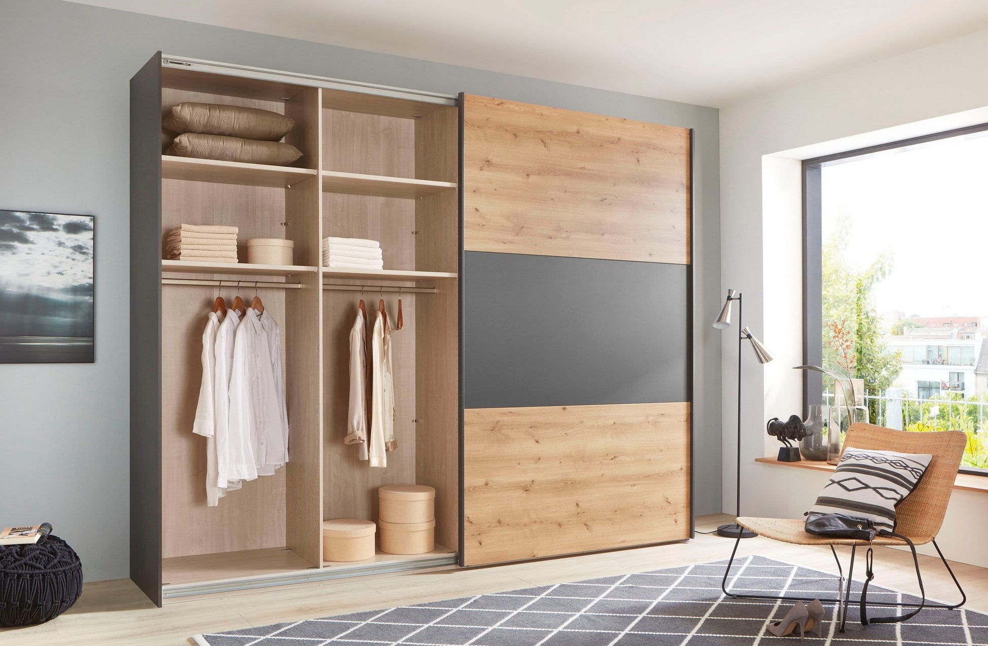 Corfu Bianco Oak & Graphite Sliding Door Wardrobe - Interior View Styled in a Living Room