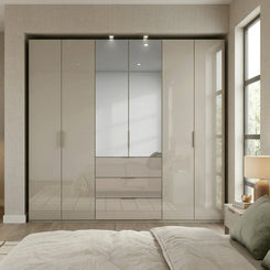 Rauch Haven  6 Door Combi Wardrobe with 4 Glass Doors and 2 Mirror Doors - Styled in a Bedroom