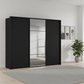 Rauch Heaven 270cm 3 Door Slider Wardrobe with 2 Décor Doors and 1 Mirror Door in Black styled in a modern bedroom